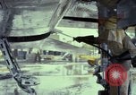 Image of Vietnamese contractor personnel clean F-100D airplane Vietnam, 1966, second 41 stock footage video 65675024991