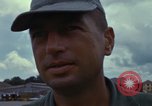 Image of Vietnamese contractor personnel clean F-100D airplane Vietnam, 1966, second 44 stock footage video 65675024991