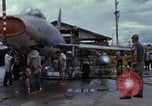 Image of Vietnamese contractor personnel clean F-100D airplane Vietnam, 1966, second 52 stock footage video 65675024991