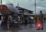 Image of Vietnamese contractor personnel clean F-100D airplane Vietnam, 1966, second 53 stock footage video 65675024991