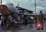 Image of Vietnamese contractor personnel clean F-100D airplane Vietnam, 1966, second 54 stock footage video 65675024991
