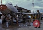 Image of Vietnamese contractor personnel clean F-100D airplane Vietnam, 1966, second 55 stock footage video 65675024991