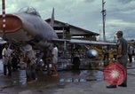 Image of Vietnamese contractor personnel clean F-100D airplane Vietnam, 1966, second 56 stock footage video 65675024991