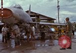 Image of Vietnamese contractor personnel clean F-100D airplane Vietnam, 1966, second 57 stock footage video 65675024991