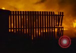 Image of Fires rage and aircraft are destroyed from rocket attack Vietnam, 1969, second 27 stock footage video 65675024997