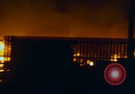 Image of Fires rage and aircraft are destroyed from rocket attack Vietnam, 1969, second 49 stock footage video 65675024997