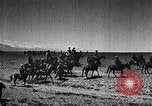 Image of Mongolian horsemen Japan, 1933, second 30 stock footage video 65675025030