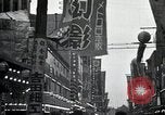 Image of Japanese in Western garb seen on city sidewalks Japan, 1931, second 29 stock footage video 65675025038