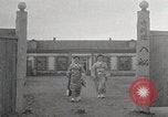 Image of Woman with sanxian Harbin China, 1932, second 15 stock footage video 65675025071
