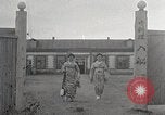 Image of Woman with sanxian Harbin China, 1932, second 16 stock footage video 65675025071