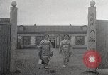 Image of Woman with sanxian Harbin China, 1932, second 17 stock footage video 65675025071