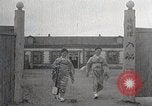 Image of Woman with sanxian Harbin China, 1932, second 18 stock footage video 65675025071