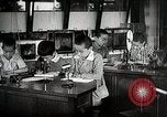 Image of Students doing assembly work Japan, 1945, second 50 stock footage video 65675025079