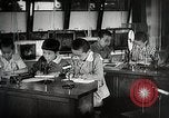 Image of Students doing assembly work Japan, 1945, second 53 stock footage video 65675025079
