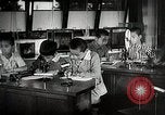 Image of Students doing assembly work Japan, 1945, second 54 stock footage video 65675025079