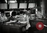 Image of Students doing assembly work Japan, 1945, second 55 stock footage video 65675025079