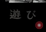 Image of Children Play and Adults Work in rice Fields During Spring Time Japan, 1934, second 1 stock footage video 65675025118
