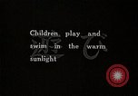 Image of Children Play and Adults Work in rice Fields During Spring Time Japan, 1934, second 4 stock footage video 65675025118