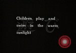 Image of Children Play and Adults Work in rice Fields During Spring Time Japan, 1934, second 6 stock footage video 65675025118