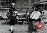 Image of Children Play and Adults Work in rice Fields During Spring Time Japan, 1934, second 20 stock footage video 65675025118