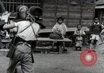 Image of Children Play and Adults Work in rice Fields During Spring Time Japan, 1934, second 30 stock footage video 65675025118