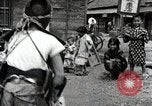 Image of Children Play and Adults Work in rice Fields During Spring Time Japan, 1934, second 40 stock footage video 65675025118