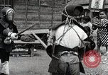 Image of Children Play and Adults Work in rice Fields During Spring Time Japan, 1934, second 42 stock footage video 65675025118