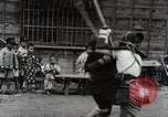 Image of Children Play and Adults Work in rice Fields During Spring Time Japan, 1934, second 46 stock footage video 65675025118