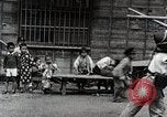 Image of Children Play and Adults Work in rice Fields During Spring Time Japan, 1934, second 48 stock footage video 65675025118
