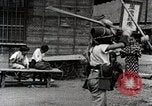 Image of Children Play and Adults Work in rice Fields During Spring Time Japan, 1934, second 50 stock footage video 65675025118