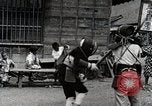 Image of Children Play and Adults Work in rice Fields During Spring Time Japan, 1934, second 54 stock footage video 65675025118