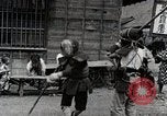 Image of Children Play and Adults Work in rice Fields During Spring Time Japan, 1934, second 56 stock footage video 65675025118