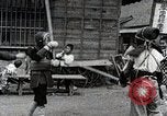 Image of Children Play and Adults Work in rice Fields During Spring Time Japan, 1934, second 58 stock footage video 65675025118
