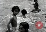 Image of Children Play and Adults Work in rice Fields During Spring Time Japan, 1934, second 59 stock footage video 65675025118