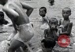 Image of Children Play and Adults Work in rice Fields During Spring Time Japan, 1934, second 61 stock footage video 65675025118
