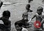 Image of Children Play and Adults Work in rice Fields During Spring Time Japan, 1934, second 62 stock footage video 65675025118