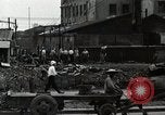 Standbild Japanische Bürger reißen Luftschutzbunker Tokio Japan Shiba Bezirk, 1945, aus Sekunde 50 historischem Filmmaterial Videoclip 65675025162
