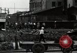 Standbild Japanische Bürger reißen Luftschutzbunker Tokio Japan Shiba Bezirk, 1945, aus Sekunde 51 historischem Filmmaterial Videoclip 65675025162