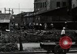 Standbild Japanische Bürger reißen Luftschutzbunker Tokio Japan Shiba Bezirk, 1945, aus Sekunde 52 historischem Filmmaterial Videoclip 65675025162