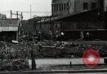 Standbild Japanische Bürger reißen Luftschutzbunker Tokio Japan Shiba Bezirk, 1945, aus Sekunde 54 historischem Filmmaterial Videoclip 65675025162