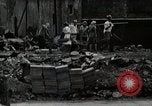Standbild Japanische Bürger reißen Luftschutzbunker Tokio Japan Shiba Bezirk, 1945, aus Sekunde 56 historischem Filmmaterial Videoclip 65675025162