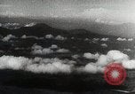 Immagine di Paracadute giapponese di truppe e materiali di consumo vengono ignorati Celebes, 1942, secondo 48 filmato di repertorio 65675025225