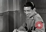 Standbild japanische Studentin joins außerschulische Aktivitäten Bloomington Indiana USA, 1951, aus Sekunde 26 historischem Filmmaterial Videoclip 65675025244