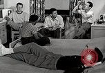 Standbild japanische Studentin mit seinem amerikanischen Mitbewohner Bloomington Indiana USA, 1951, aus Sekunde 11 historischem Filmmaterial Videoclip 65675025245