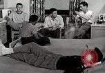 Standbild japanische Studentin mit seinem amerikanischen Mitbewohner Bloomington Indiana USA, 1951, aus Sekunde 12 historischem Filmmaterial Videoclip 65675025245