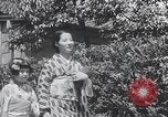 Image of Family makes an excursion to cherry blossom festival Japan, 1941, second 27 stock footage video 65675025255