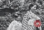 Image of Family makes an excursion to cherry blossom festival Japan, 1941, second 28 stock footage video 65675025255