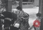 Image of Family makes an excursion to cherry blossom festival Japan, 1941, second 60 stock footage video 65675025255