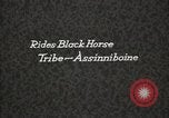 Image of Native American Indian Assinniboine Chief Rides Black Horse Fort Browning Montana USA, 1930, second 3 stock footage video 65675025306