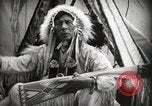 Image of Native American Indian Assinniboine Chief Rides Black Horse Fort Browning Montana USA, 1930, second 7 stock footage video 65675025306